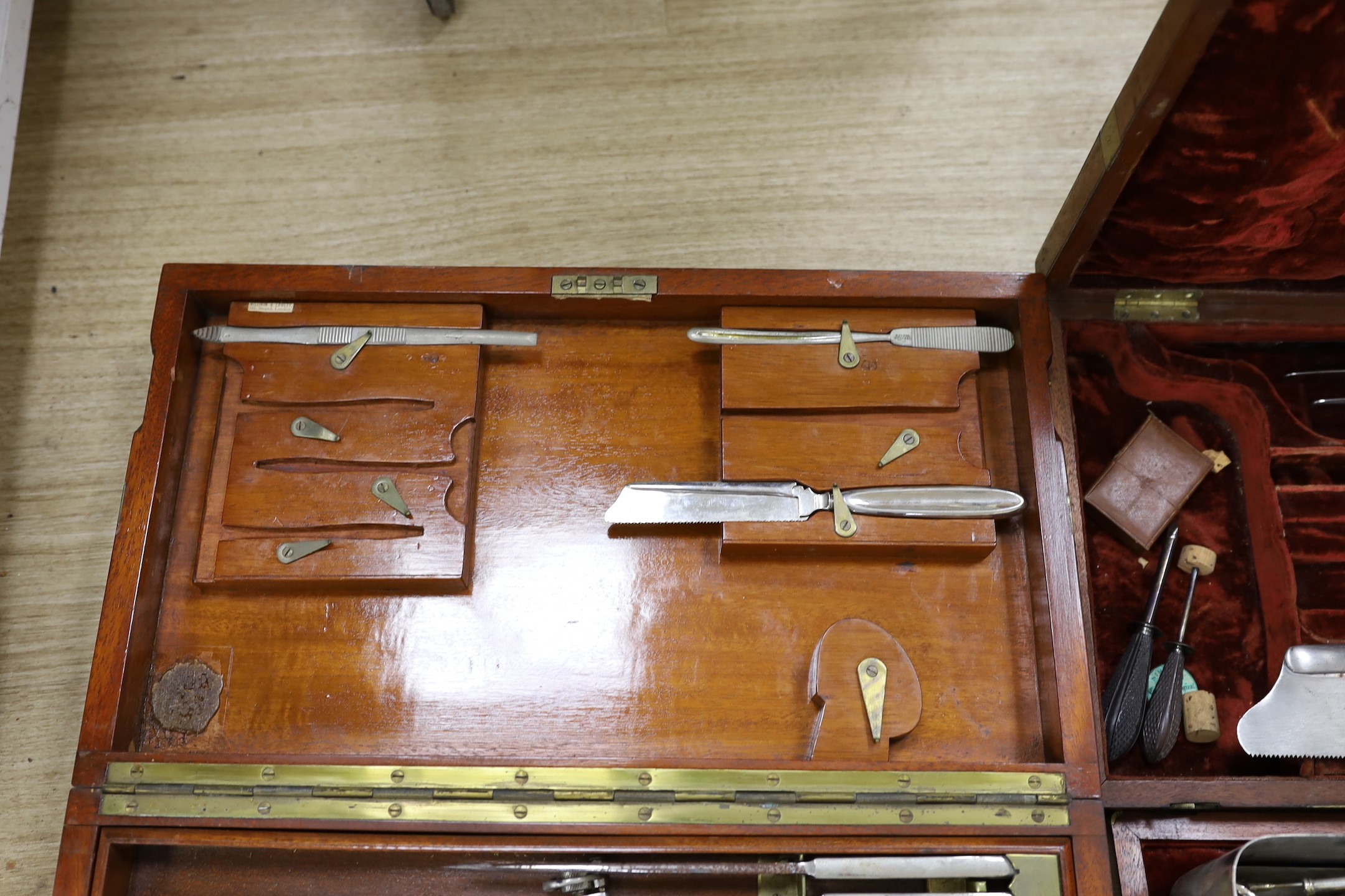 A 19th century mahogany cased field surgeon’s set (incomplete), and other field medical equipment, all three in brass banded mahogany boxes